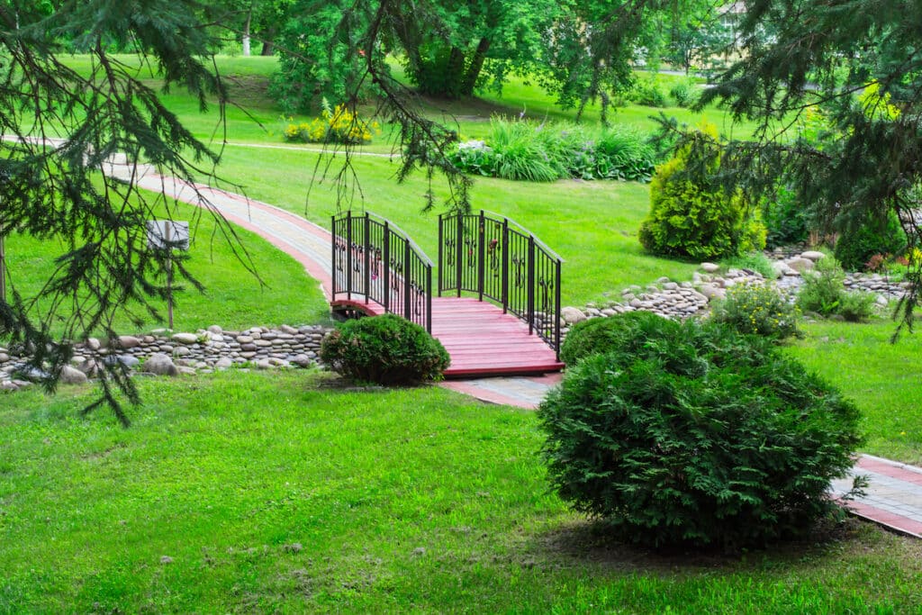 bridge over the brook in the park.  Landscape design concept.